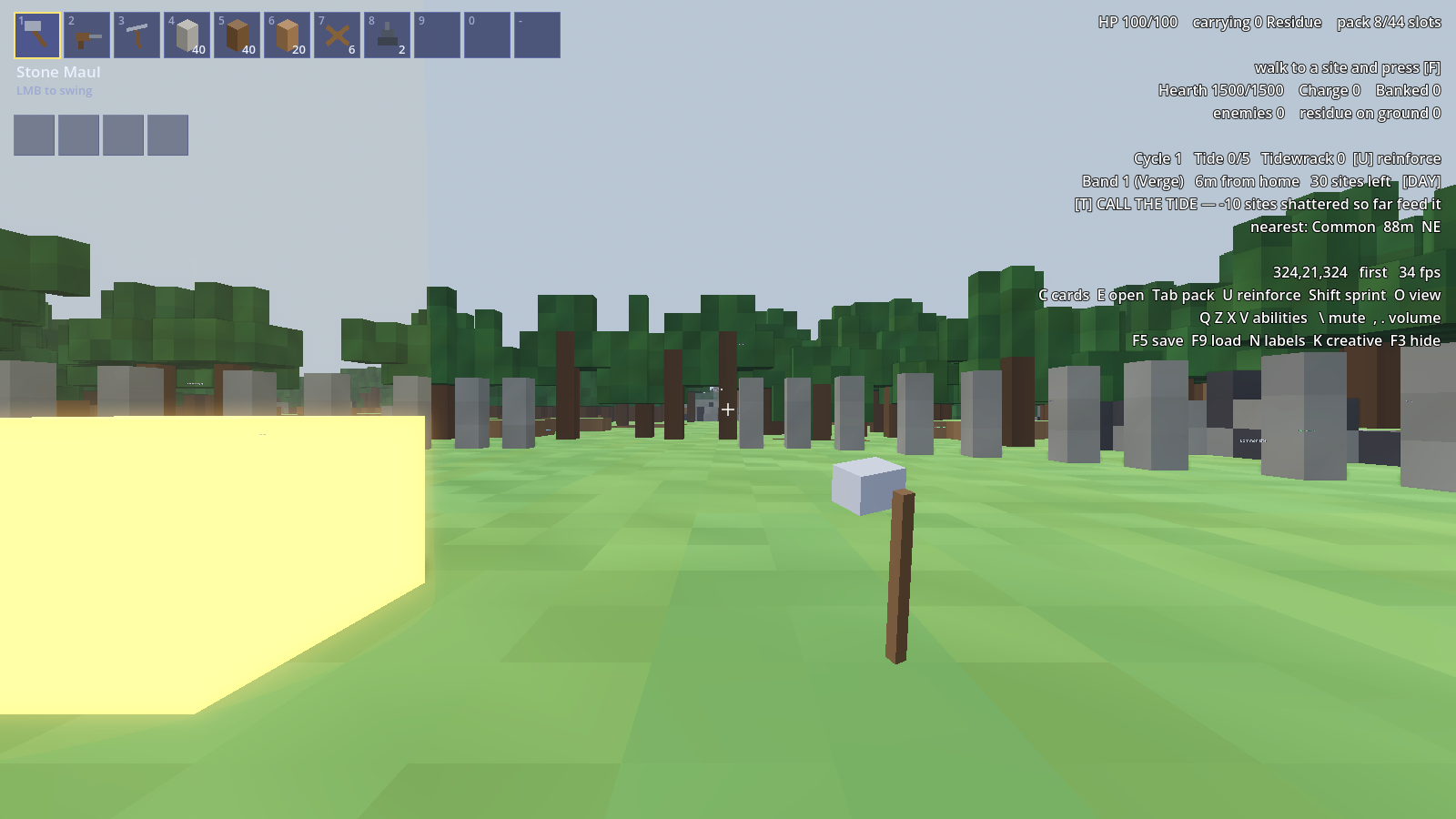 A new world: grass, a forest edge and stone pillars